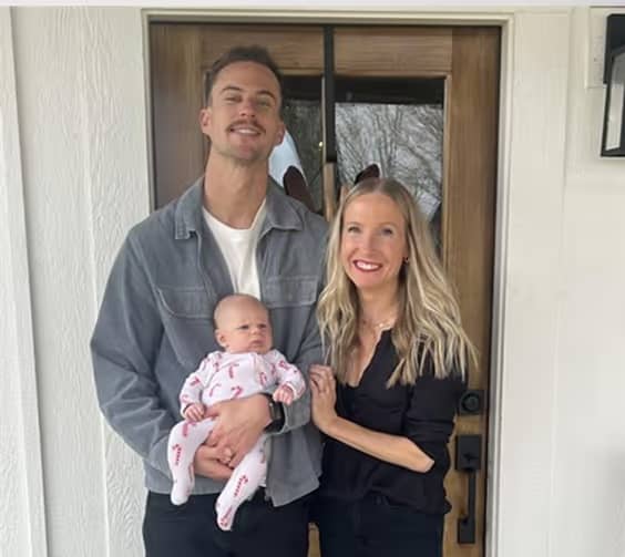 Happy family in front of their new home