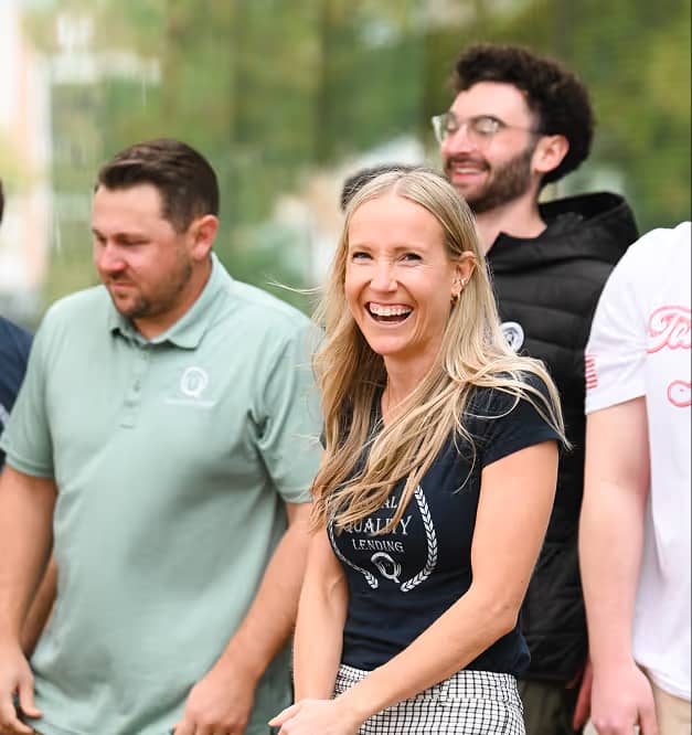 TQL agents smiling together at a team gathering
